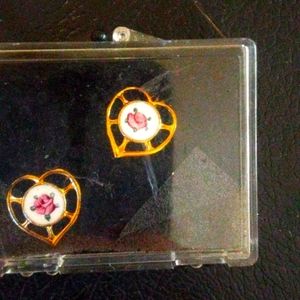 Earrings with rose on them